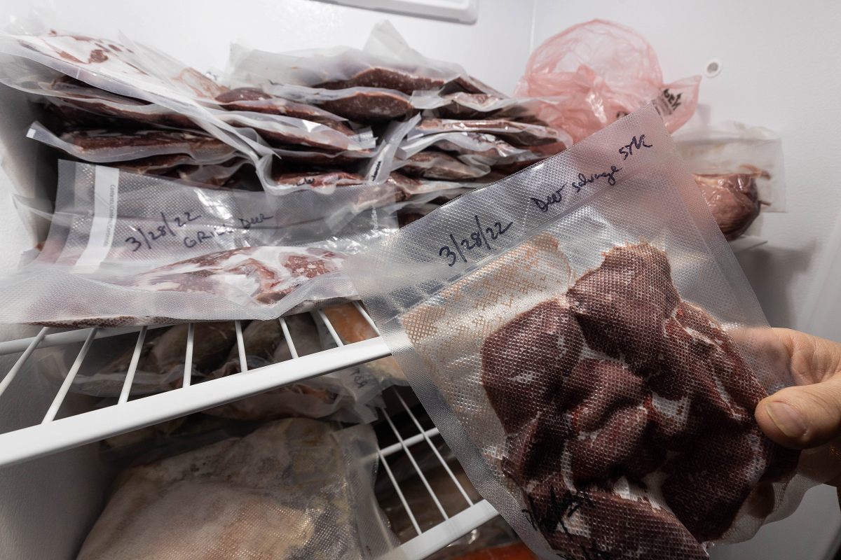 A reusable vacuum-sealed bag containing meat harvested from a roadkill deer.