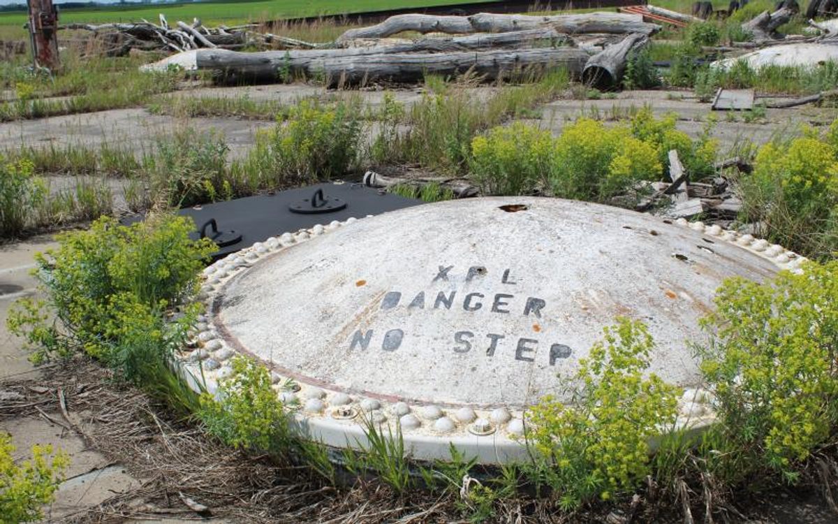 Much of the site is rusted and overgrown.