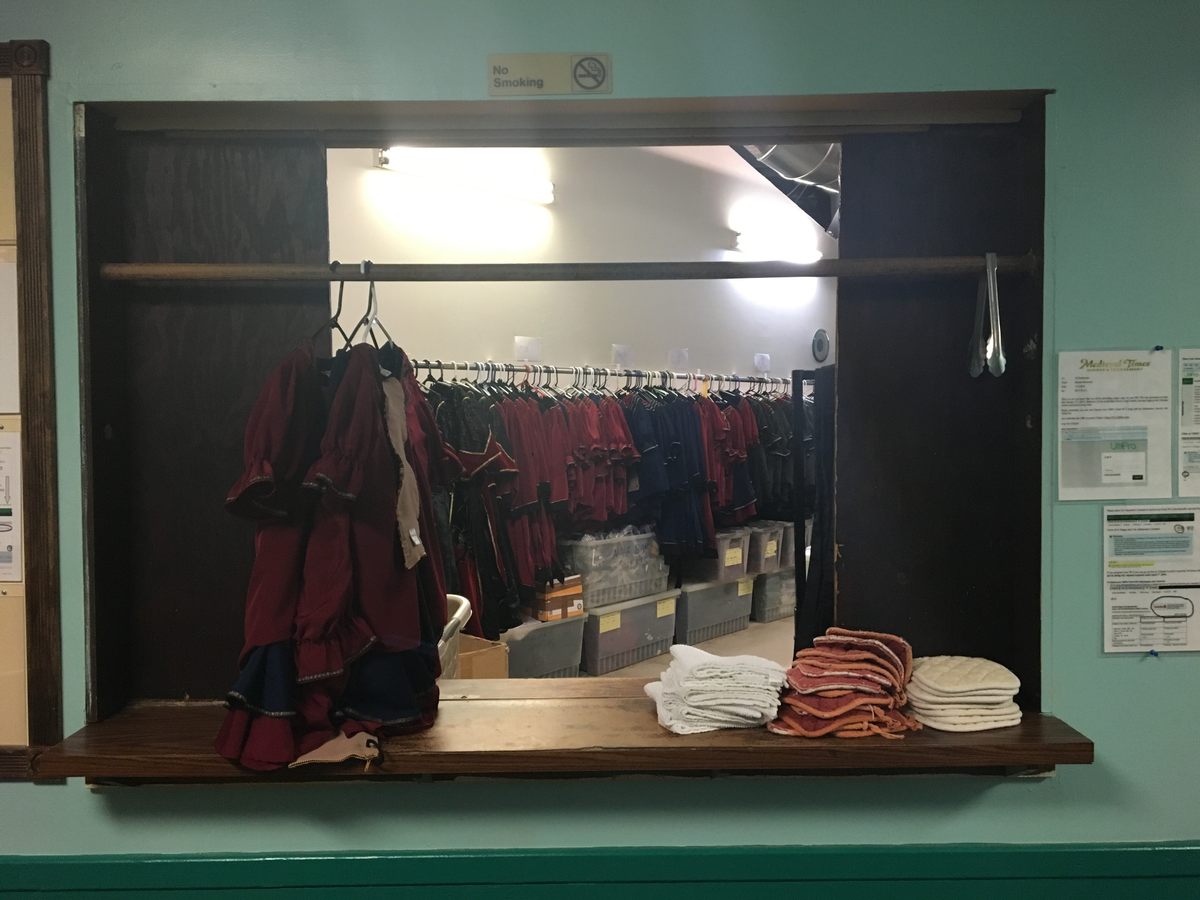 Where servers and salespeople collect their medieval attire.