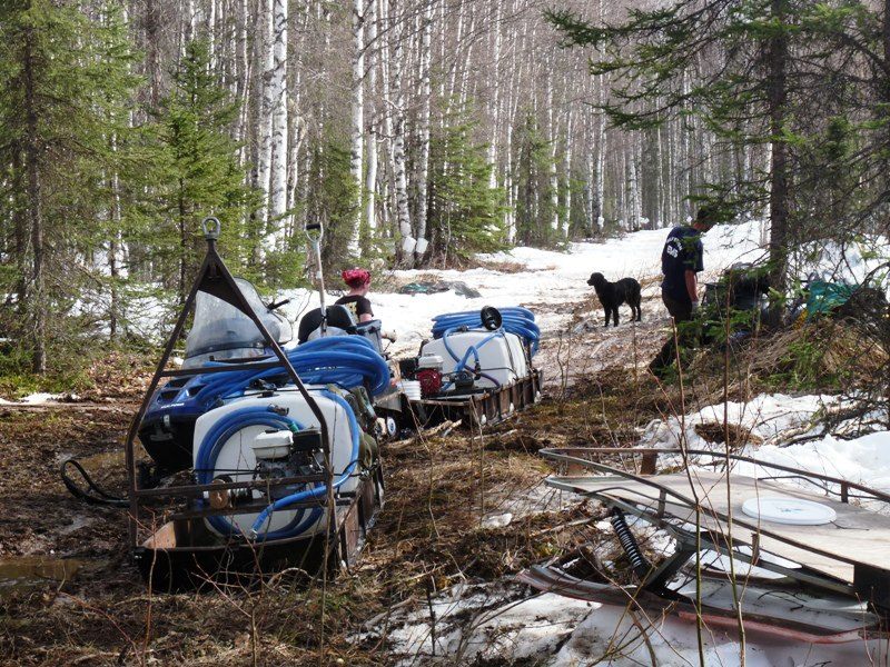 Hauling tapping equipment through slush and mud can be taxing.