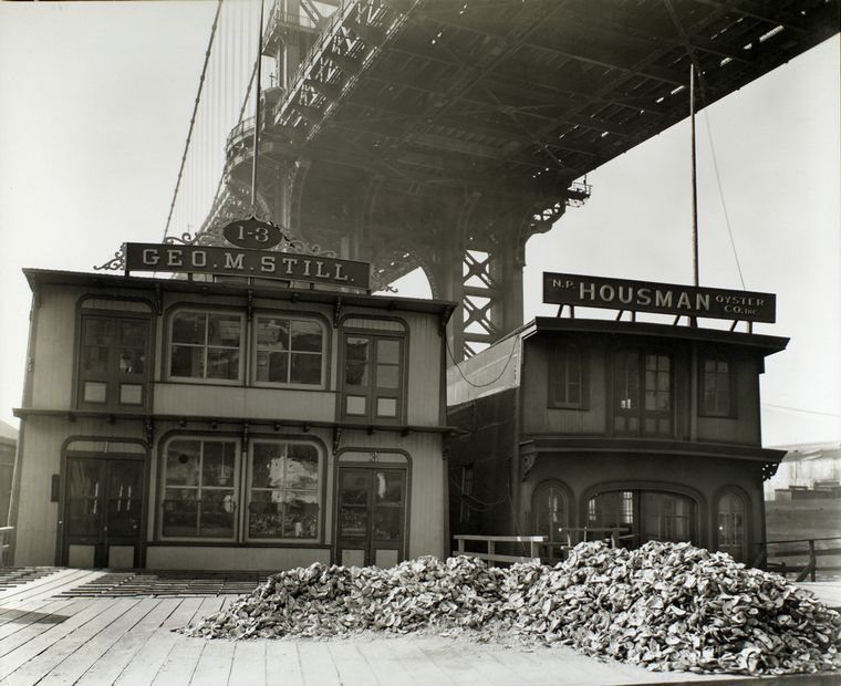 A 1935 photograph by Berenice Abbott of oyster houses on South Street and Pike Slip, Manhattan.