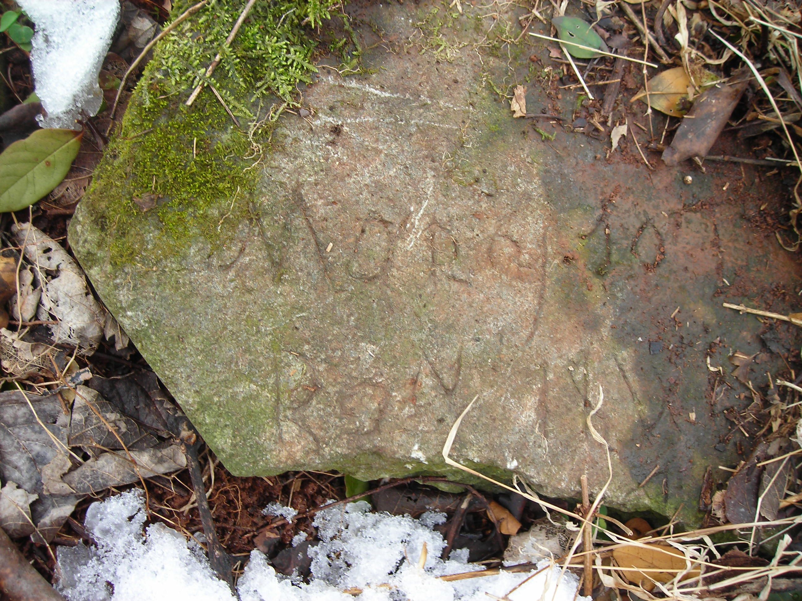 A grave marker from the Estouteville Plantation, another property that holds a slave cemetery in central Virginia. It shows an inscription which has not yet been deciphered.