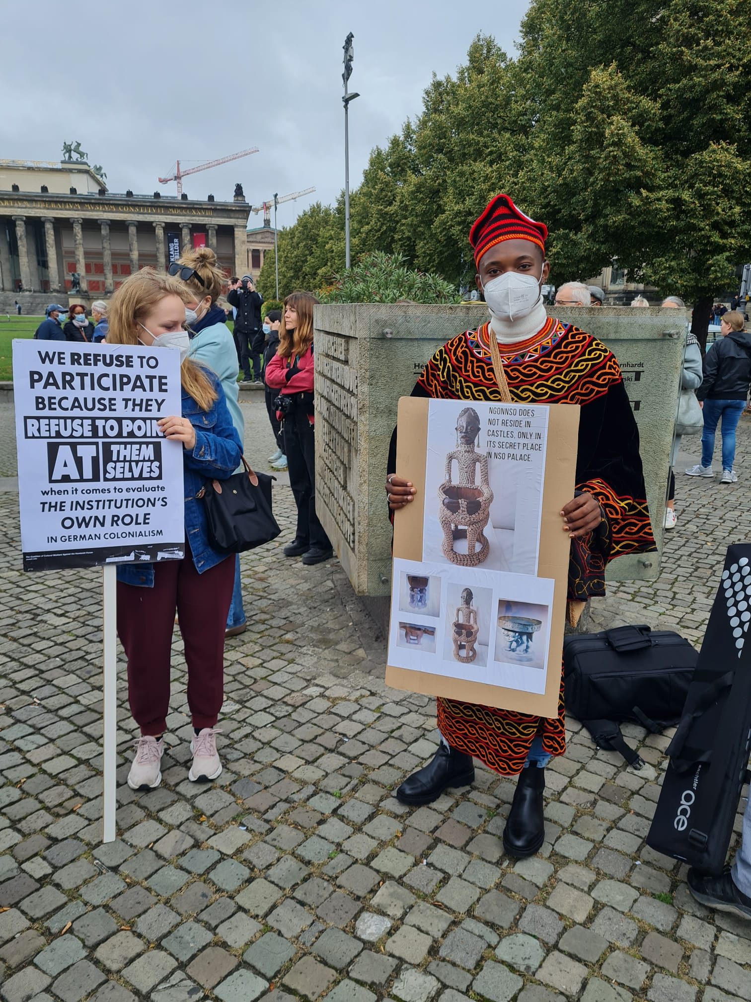 Cornelius and Anniker Maurer protest in front of the Humboldt Forum.