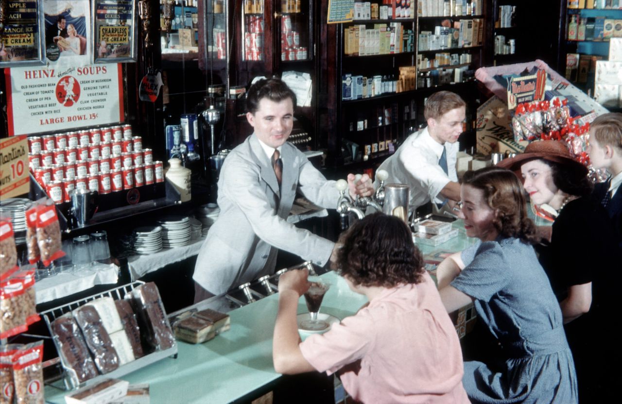 A Pharmacist works the soda fountain at the Clayton & Edward Chemists and Pharmacy in New York City, circa 1948.