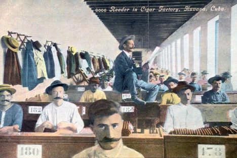 A circa 1907 postcard of readers in a cigar factor in Havana, Cuba
