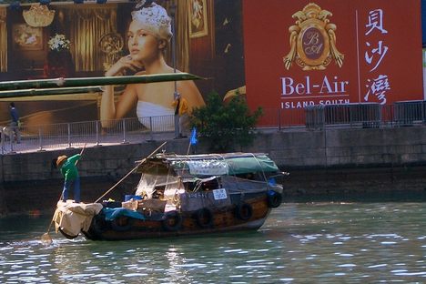 Boat dweller wearing a traditional hat