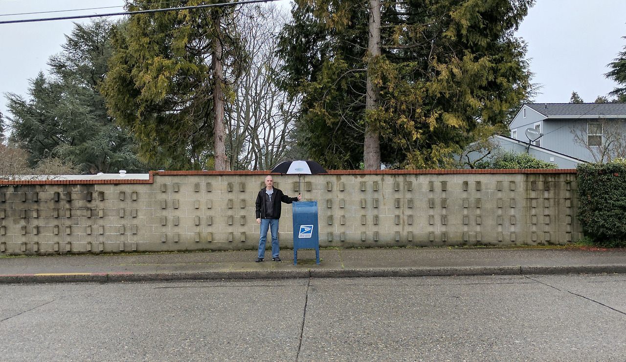 Peterman protects one of his new friends from the elements.
