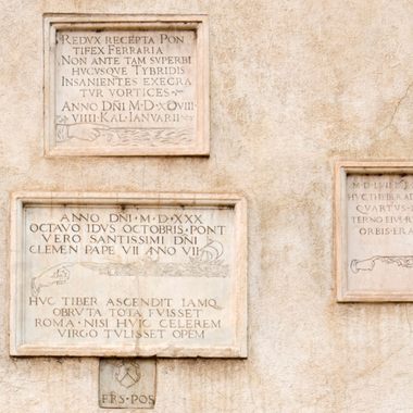 The plaques on the side of the church.