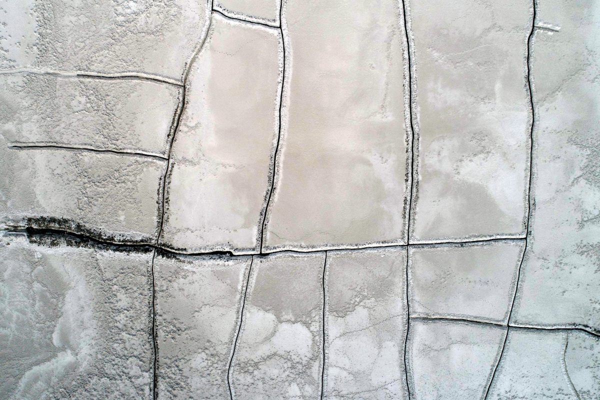 In winter, frigid temperatures make the salt crystallize.