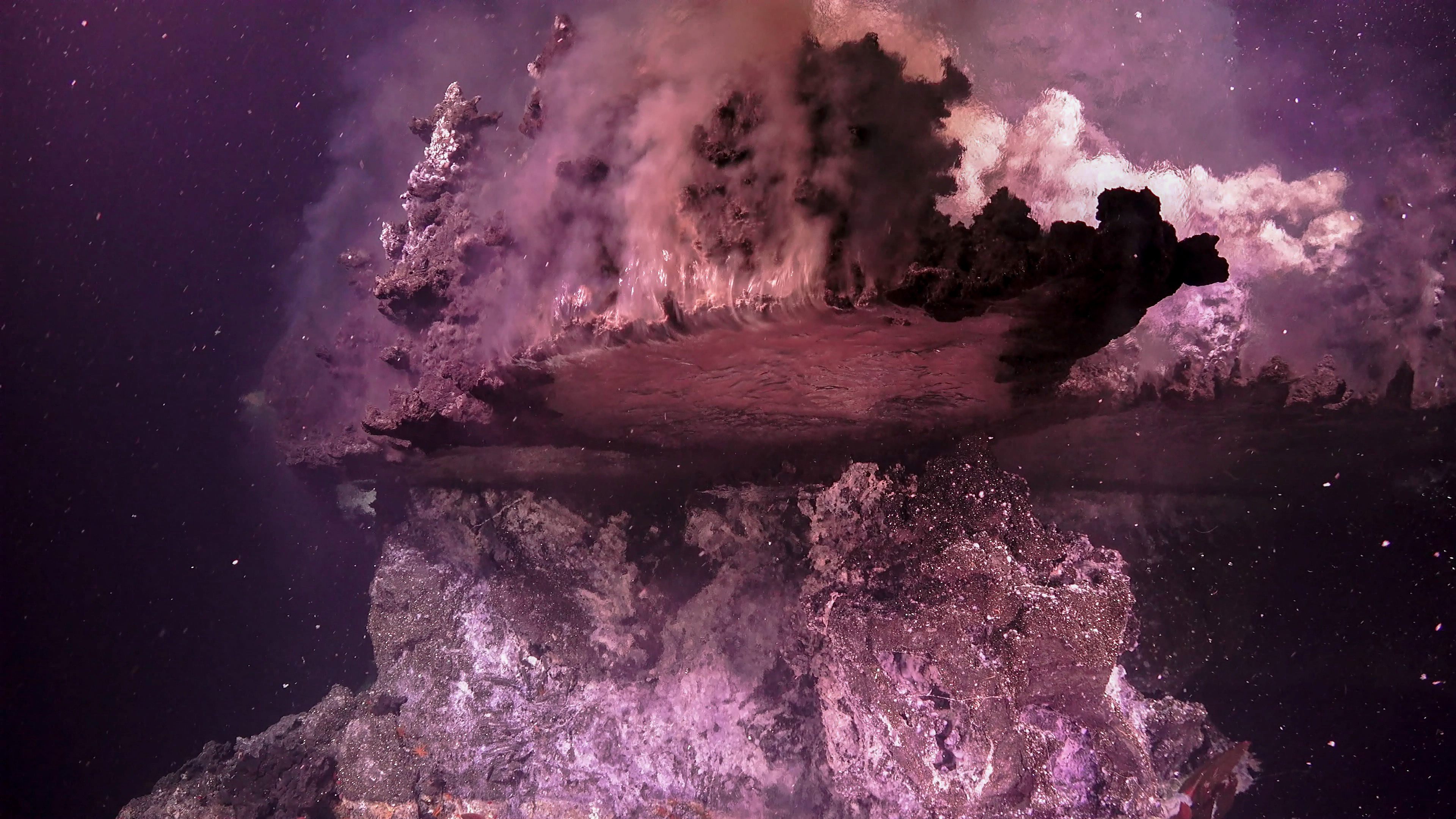 A "mirror pool" below a volcanic flange in the Gulf of California.