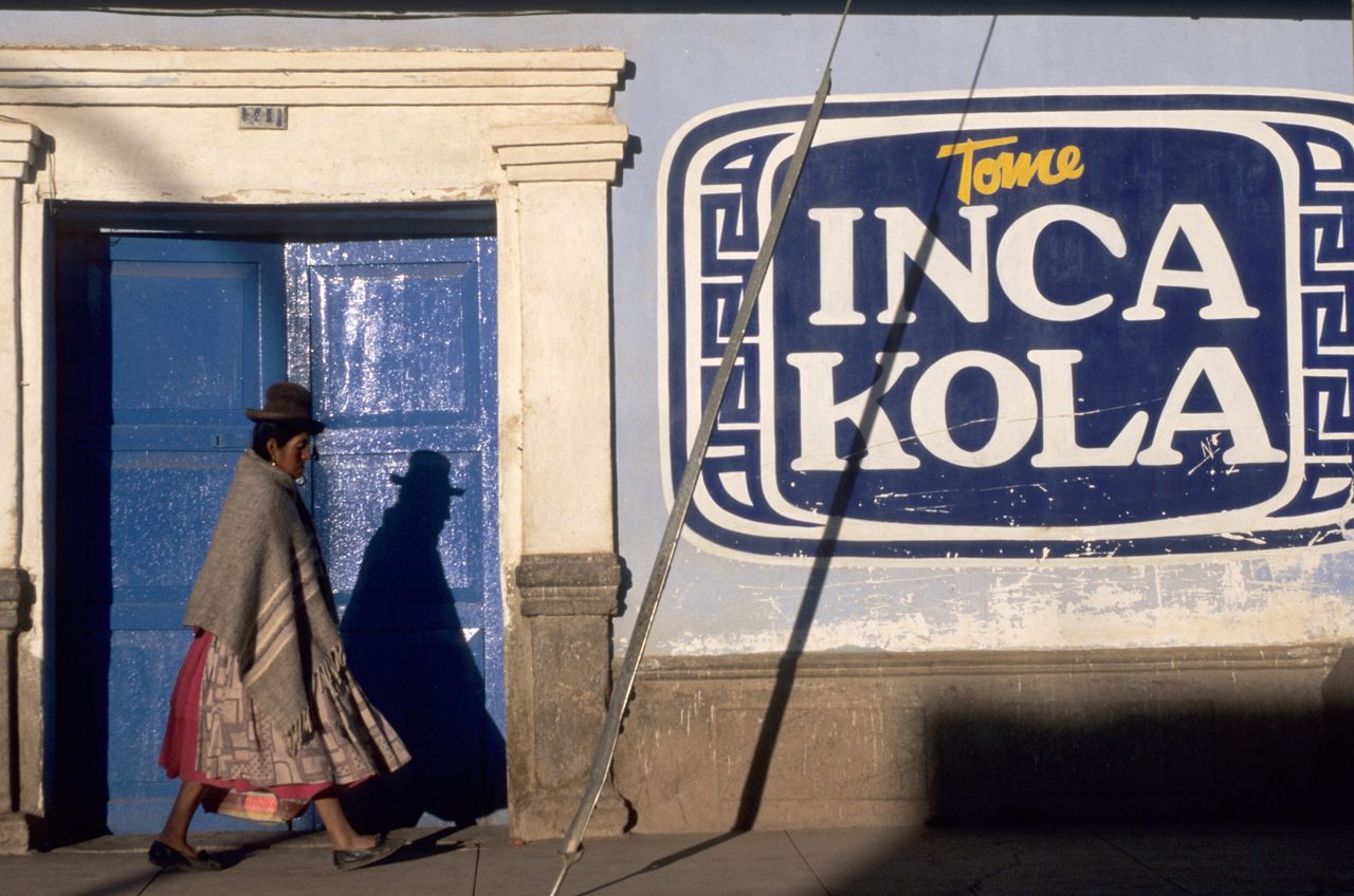 The sign reads "Drink Inca Kola."