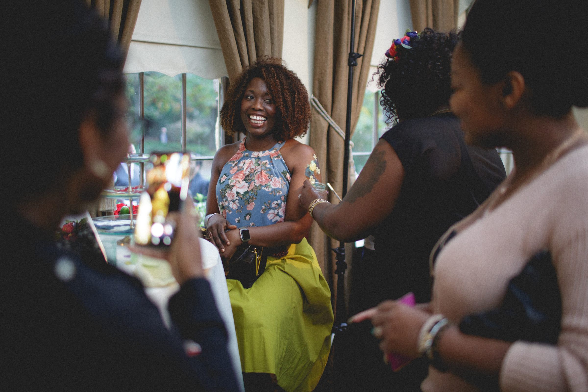 A guest is garnished with a real pressed flower tattoo.