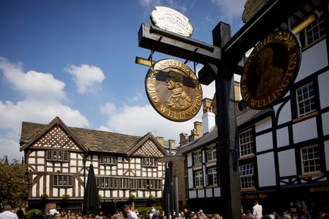 The Sign for the Old Wellington, with the Old Wellington itself in the background on the left.