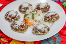 Order a round of garnachas, masa disks with shredded pork.