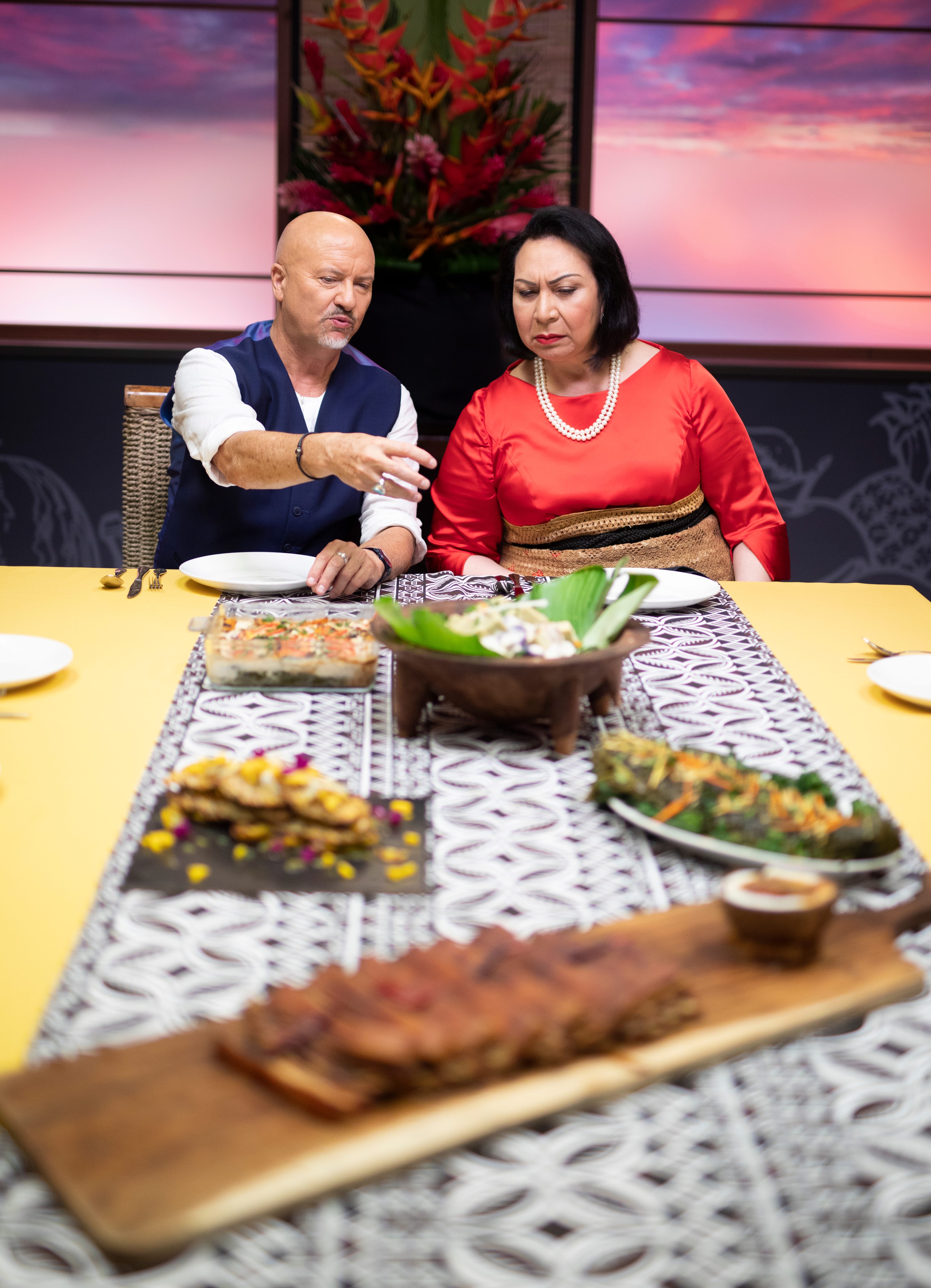 Robert Oliver and Salote Mafileʻo Pilolevu Tuita, the princess royal of Tonga, ruminate over a dish.