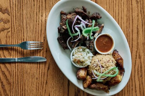 The kabrit, or twice-cooked goat, with plantains and rice and beans is essential.