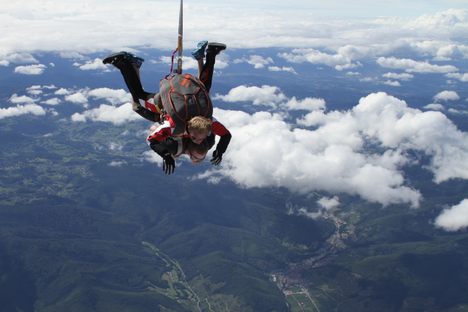 Fleeting Wonders: Skydiver Dangles From a Plane at 10,000 Feet