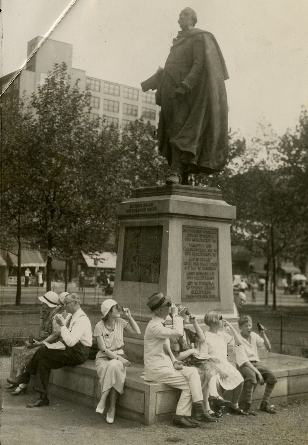 A group views the solar eclipse from Reyburn Plaza, Philadelphia, 1932.