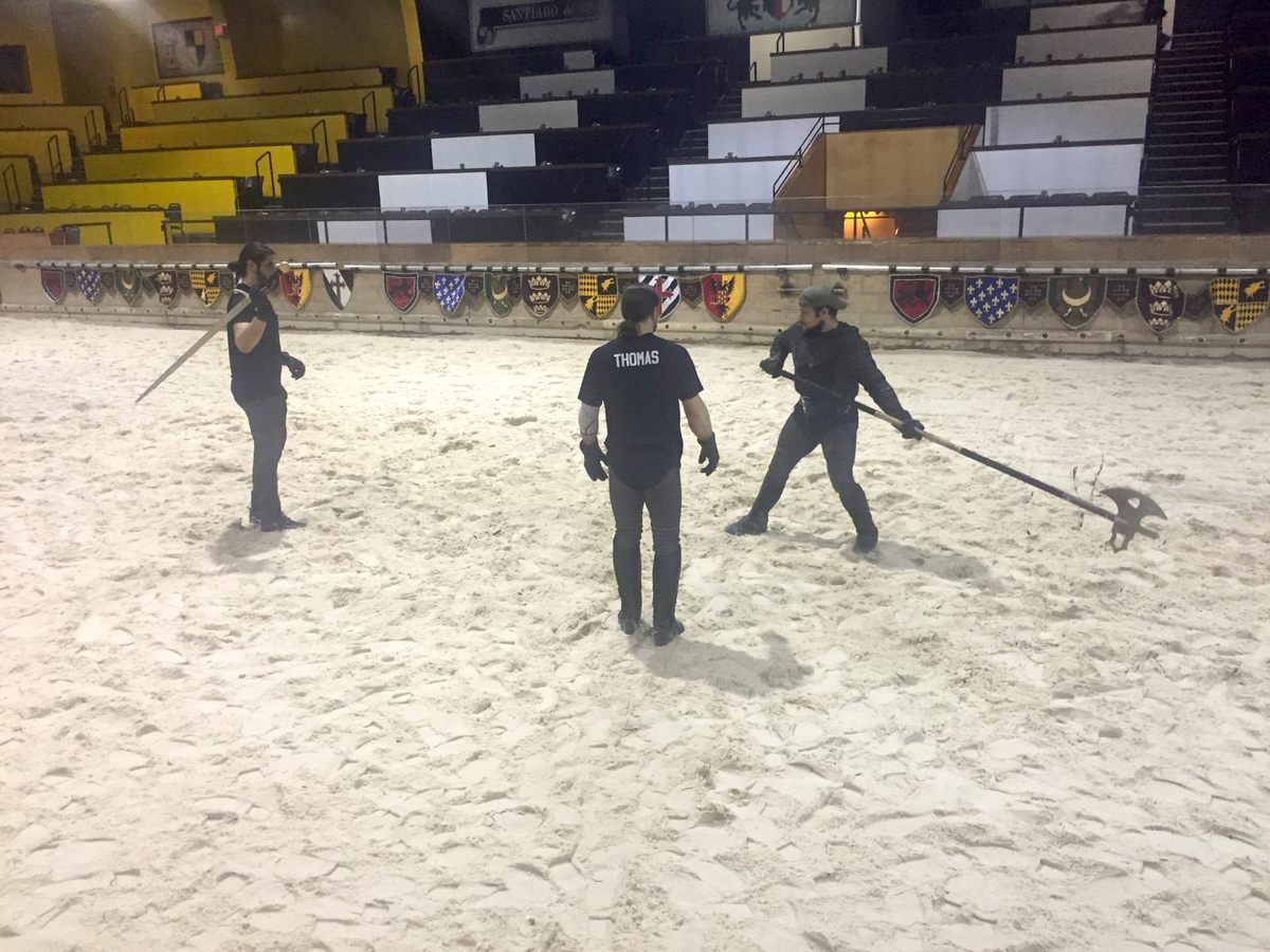 Knights practice their fight choreography before the show.