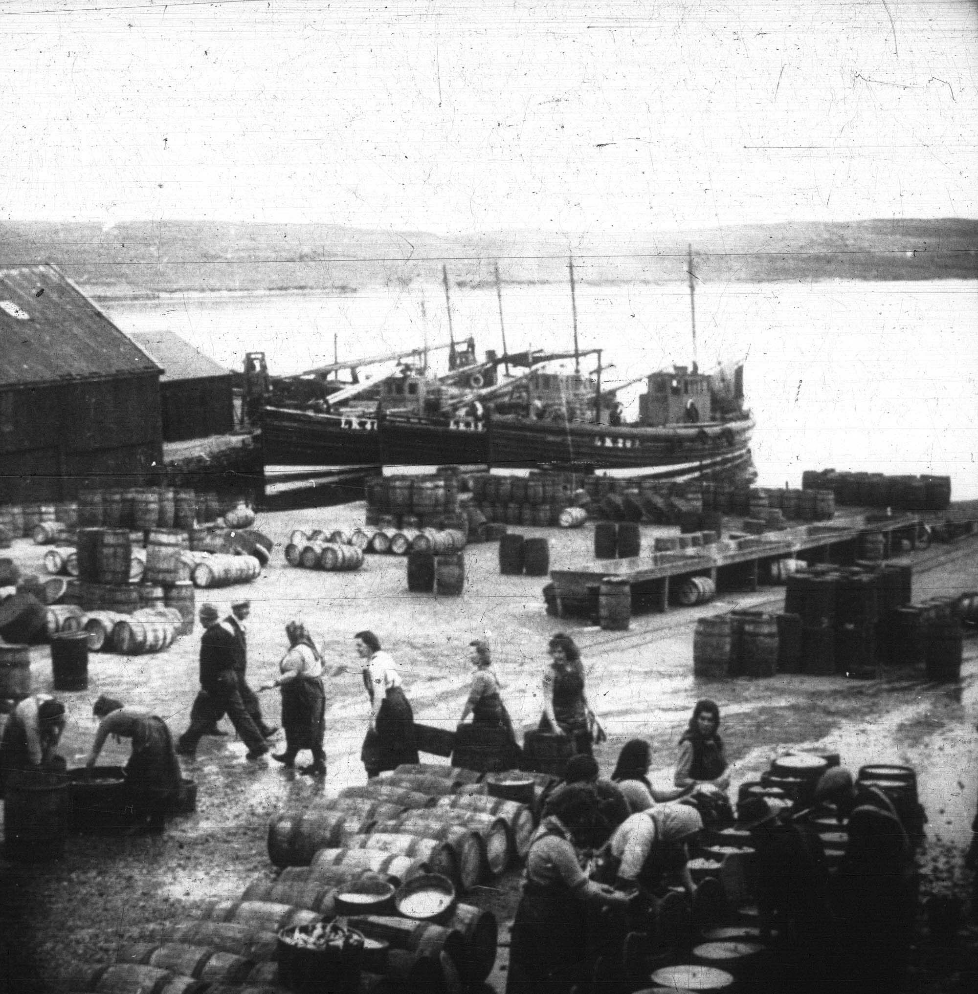 Gutters at Hay's Docks, Lerwick, with fishing boats berthed in the background, photographed by G. Robertson. 