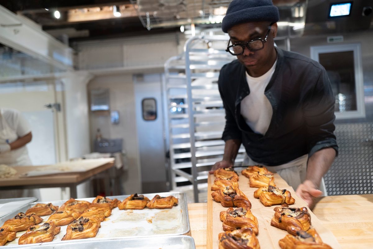 Amadou Ly prepares trays of mushroom danishes.