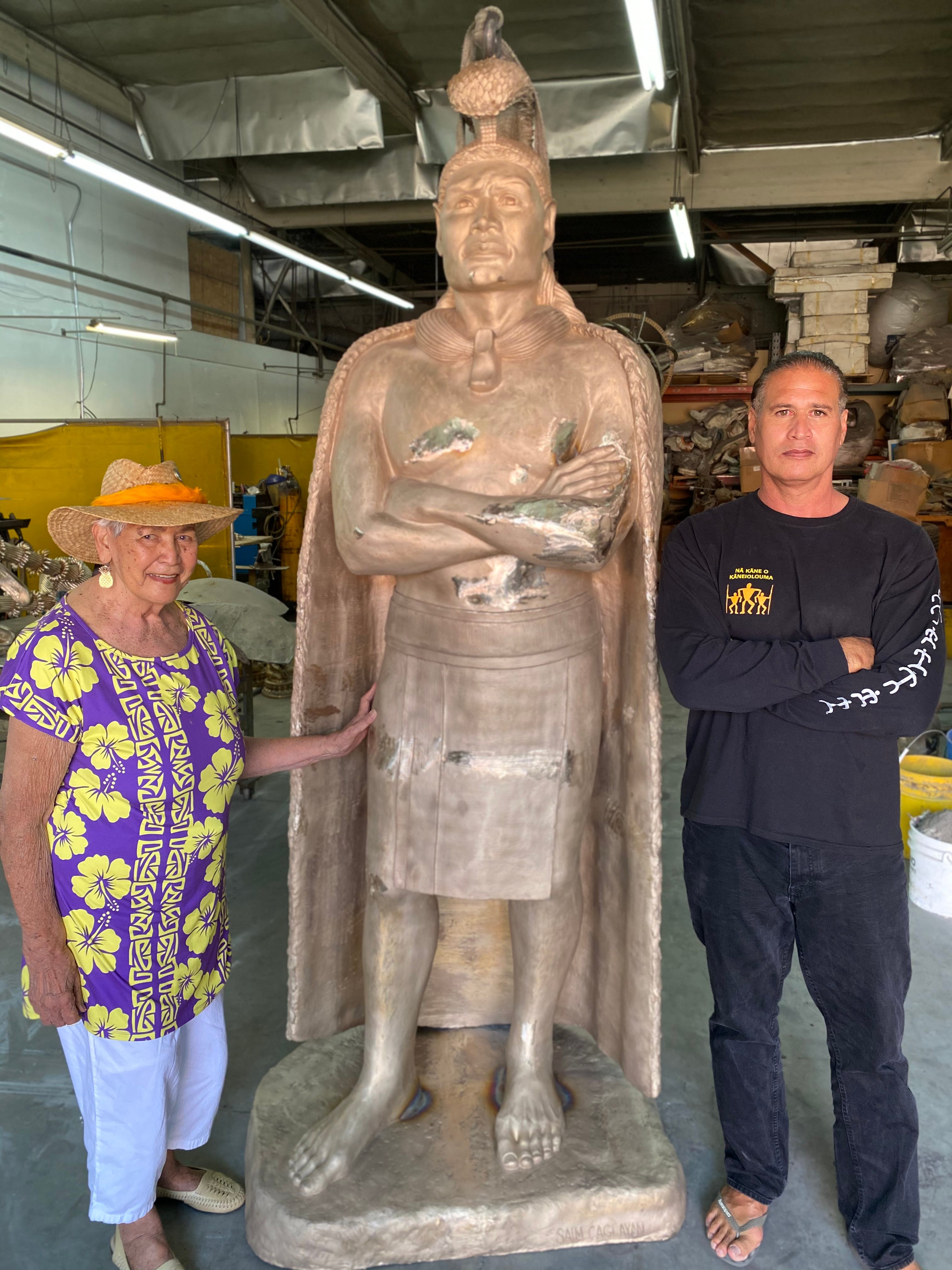Keao NeSmith and his mother, posing next to the unfinished statue, are proud descendants of King Kaumuali’i.
