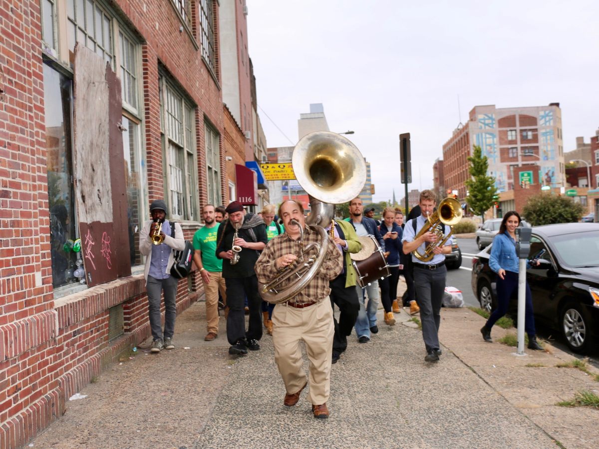 The West Philadelphia orchestra leads volunteers to the after party.