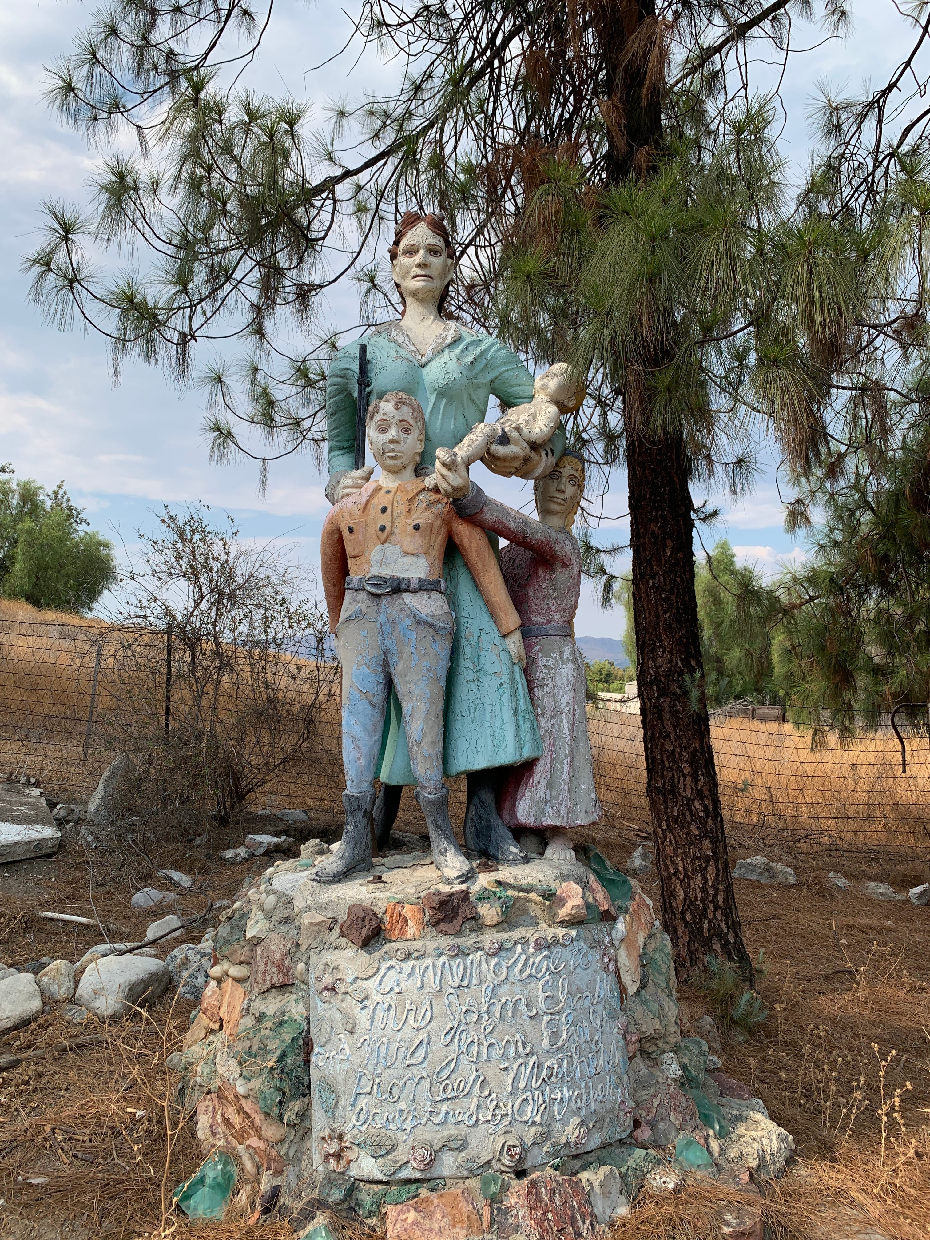 This statue of a stoic white settler and her children is dedicated to the 