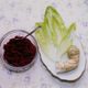 Maror in three forms: a mixture of grated horseradish, beets, and sugar; endive lettuce; and horseradish root.