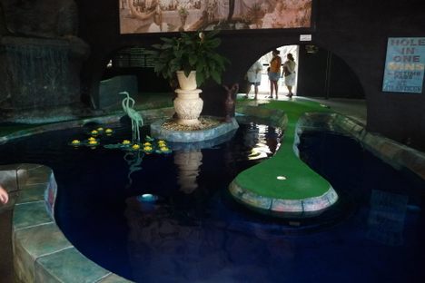 A decommissioned department store has been designed to look like a cave, filled with water fixtures and faux fauna. 