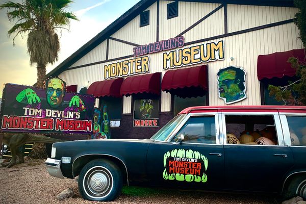 Outside Tom Devlin’s Monster Museum in Boulder City, NV, with the owner’s custom hearse parked in front. 
