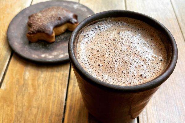 A cup of fermented, 70 percent cacao drinking chocolate with a marranito.