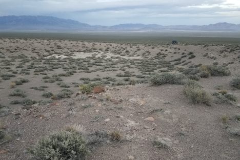 Looking due east across the crater; vehicle for scale.