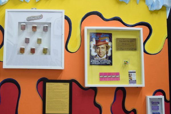 On the right, Willy Wonka movie memorabilia, including the golden ticket.