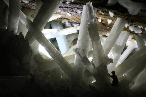 Gypsum crystals of the Naica cave. Note person for scale. Author: Alexander Van Driessche