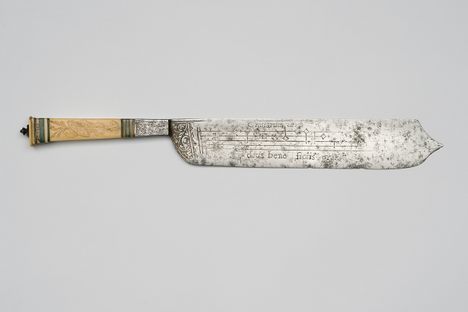 The knives are inscribed with musical notes and a prayer. 