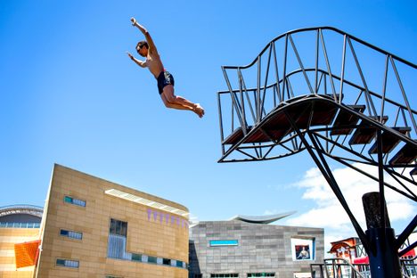 A diver leaps into the air.