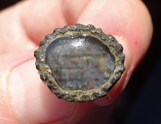 The pewter-set cufflink found in London.
