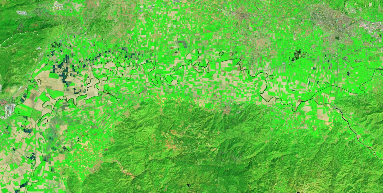 In a false-color satellite image, the winding Büyük Menderes is a dark ribbon snaking through the Turkish countryside, with many oxbow lakes—created when the river changed course—visible.