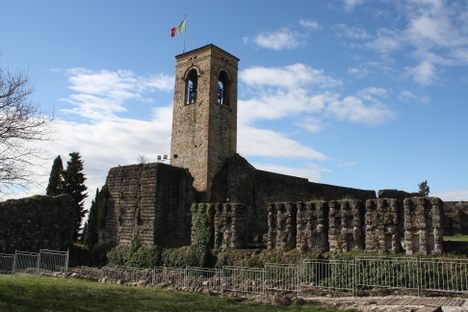 A tall stone bell tower rises