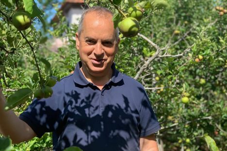 Father Rui Sousa in the parish orchards.