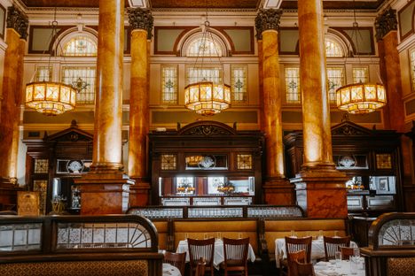 The building features brass, mahogany, and marble, 