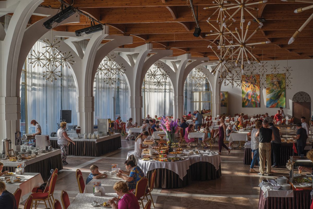 The dining hall at the Lipki sanatorium in Russia, where modern treatments, including chocolate body wraps and fish pedicures, are offered.