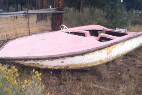 An odd pink boat near the caretaker's house.