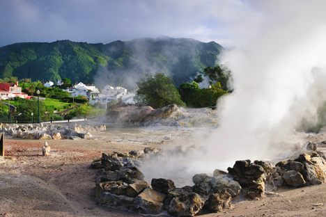 Steam rises from a hot spring in Furnas in the Azores.
