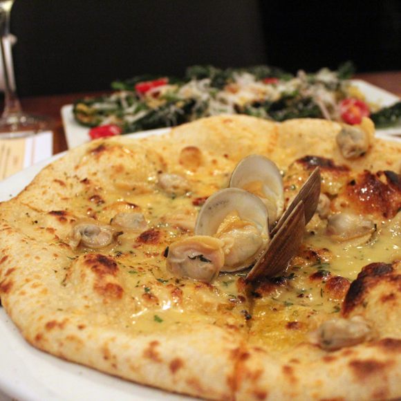 In-shell littleneck clams accentuate this clam pie.