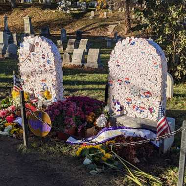 The Susan B. Anthony (left) and Mary Stafford Anthony (right) graves covered in voting stickers in 2020.