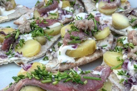 Surstromming on flatbread.