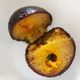 A cross-section of syrup-soaked kala jamun.