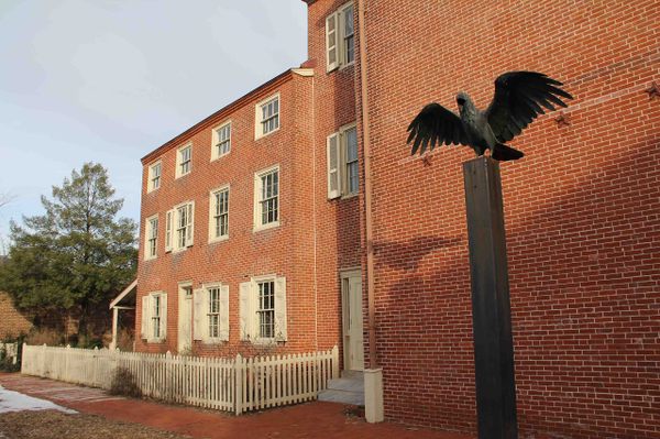 A raven statue outside the Edgar Allan Poe National Historic Site.